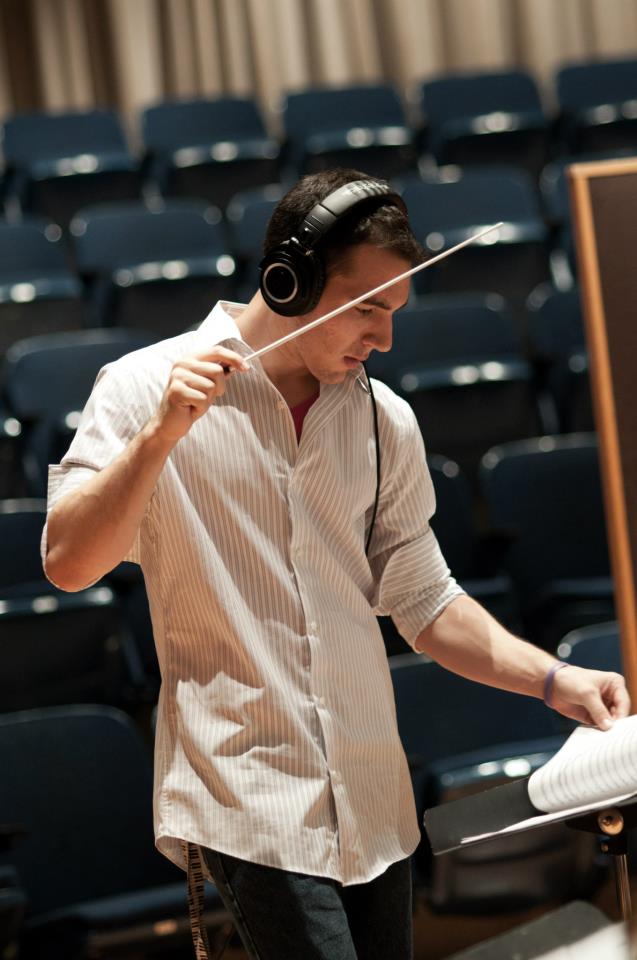 Dillon DeRosa conducting an orchestra session